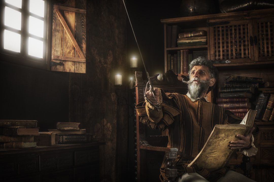 Don Quixote loosing his mind while reading chivalry books